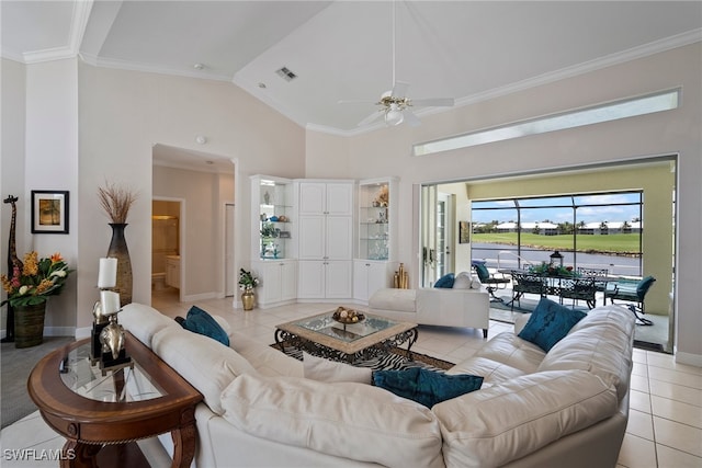 living room with light tile patterned flooring, ornamental molding, and high vaulted ceiling