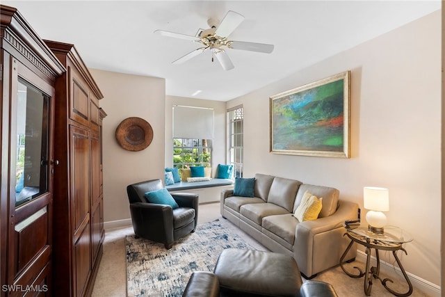 carpeted living room featuring ceiling fan