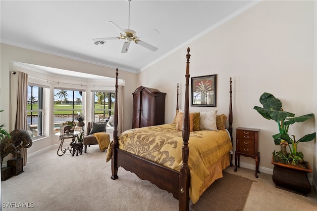 carpeted bedroom featuring crown molding, ceiling fan, and vaulted ceiling