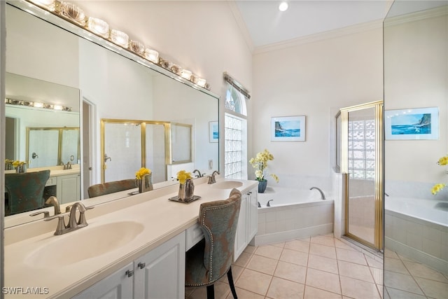 bathroom featuring crown molding, vanity, shower with separate bathtub, and tile patterned flooring