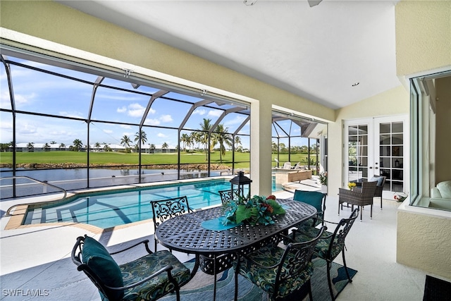 view of swimming pool with french doors, a water view, a lanai, and a patio