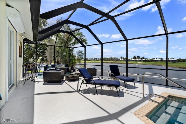 view of patio / terrace featuring a lanai, outdoor lounge area, and a water view