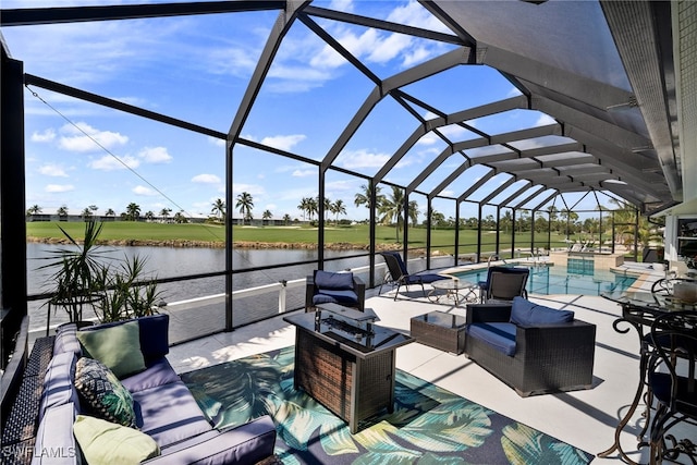 view of patio / terrace with a water view, an outdoor hangout area, and a lanai