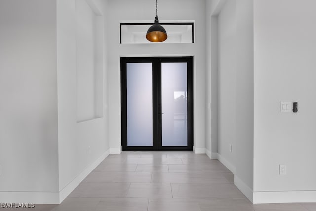 entryway with light tile patterned floors