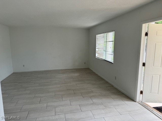 view of tiled spare room