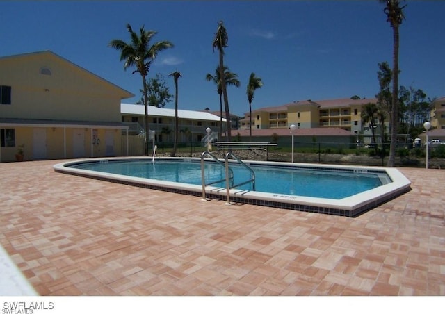 view of swimming pool with a patio