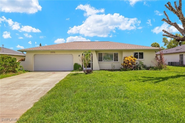 ranch-style home with a garage and a front yard