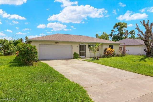 ranch-style house featuring a garage and a front yard