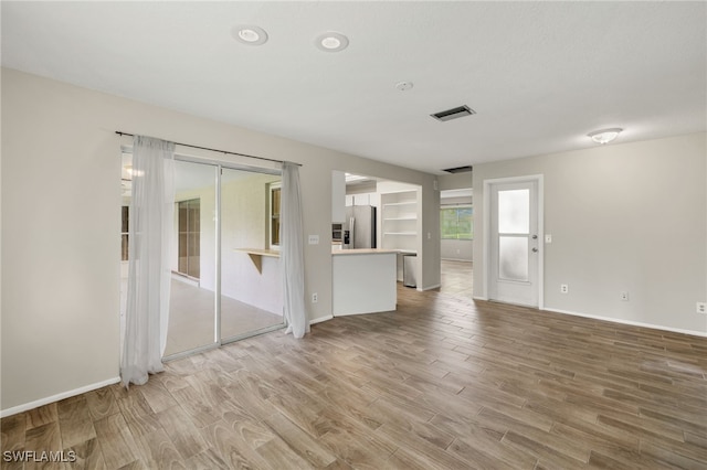 spare room featuring hardwood / wood-style floors