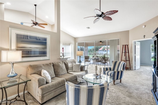 living room with high vaulted ceiling, light colored carpet, and ceiling fan