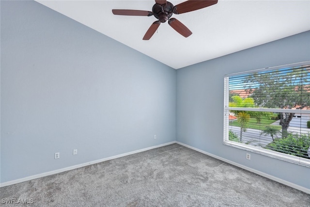 unfurnished room with vaulted ceiling, ceiling fan, and carpet