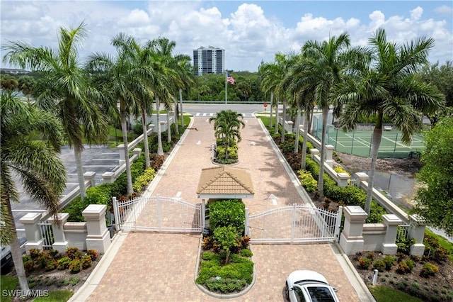 view of community with a gate and fence