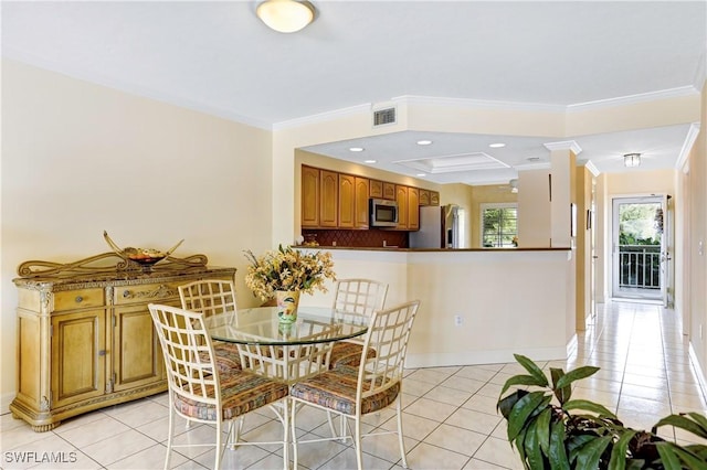 dining room featuring light tile patterned floors, recessed lighting, visible vents, ornamental molding, and a raised ceiling