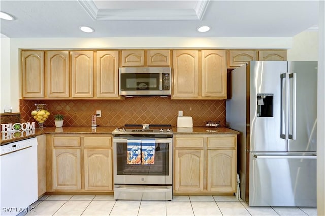 kitchen with light brown cabinetry, appliances with stainless steel finishes, and dark stone countertops