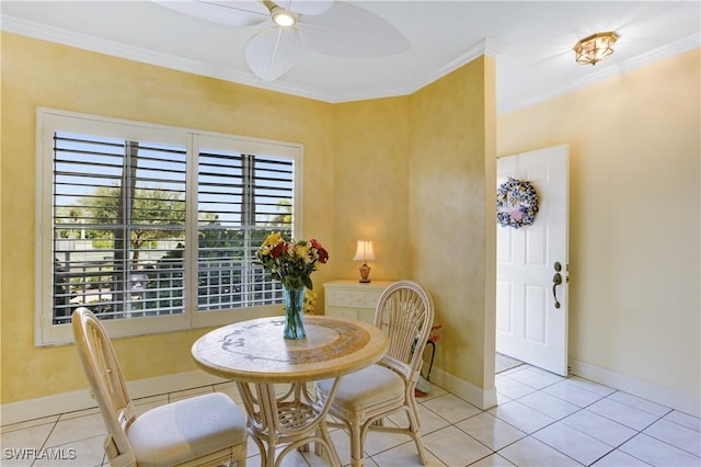 dining space featuring ceiling fan, light tile patterned flooring, and crown molding