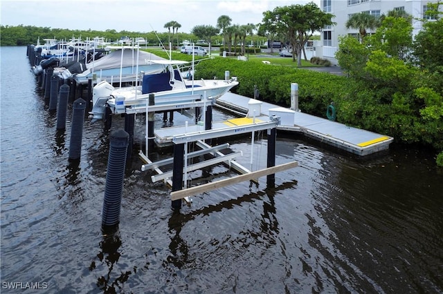 view of dock featuring a water view and boat lift