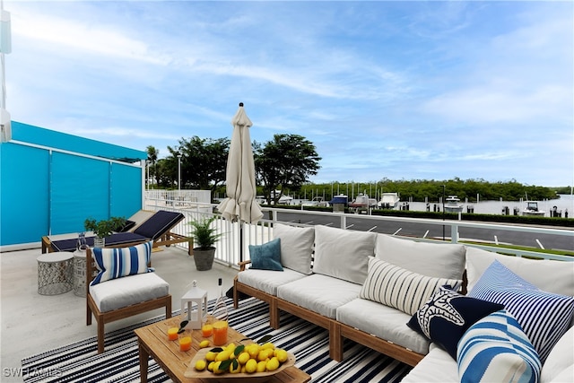 view of patio / terrace featuring a balcony and an outdoor living space