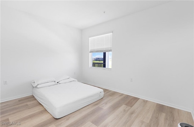 bedroom featuring light wood-type flooring