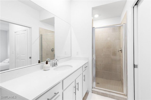 bathroom with vanity and an enclosed shower