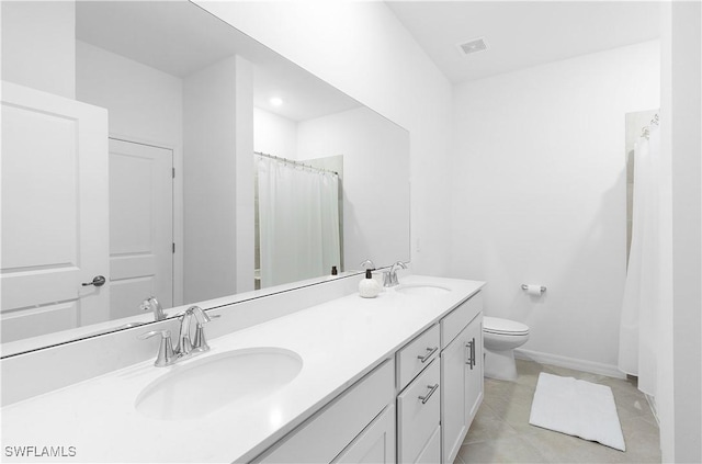 bathroom featuring vanity, curtained shower, tile patterned floors, and toilet