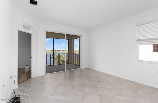 empty room with light tile patterned flooring