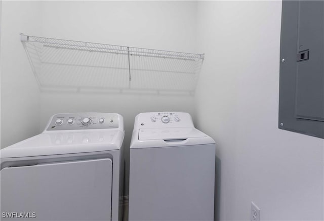 laundry room featuring separate washer and dryer and electric panel