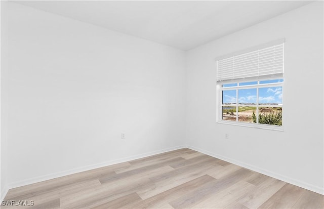 unfurnished room featuring light hardwood / wood-style flooring