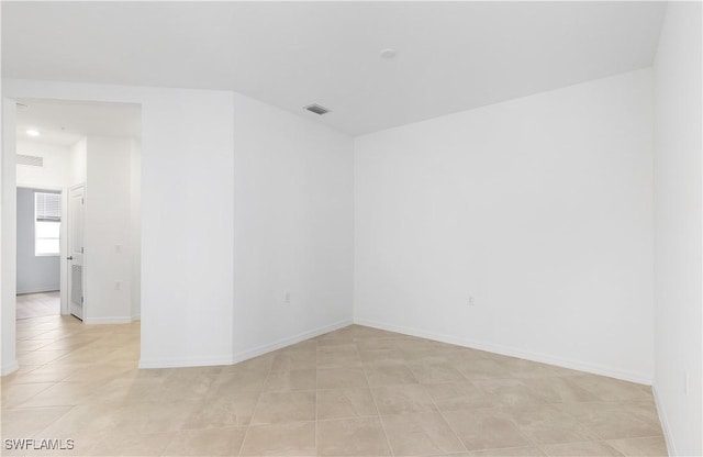 empty room with light tile patterned flooring