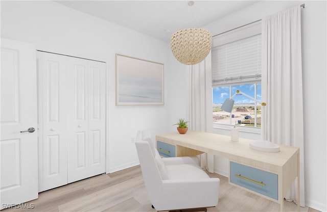 office area with light hardwood / wood-style flooring