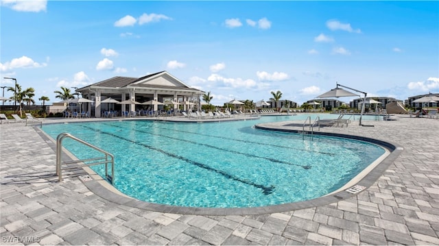 view of swimming pool with a patio