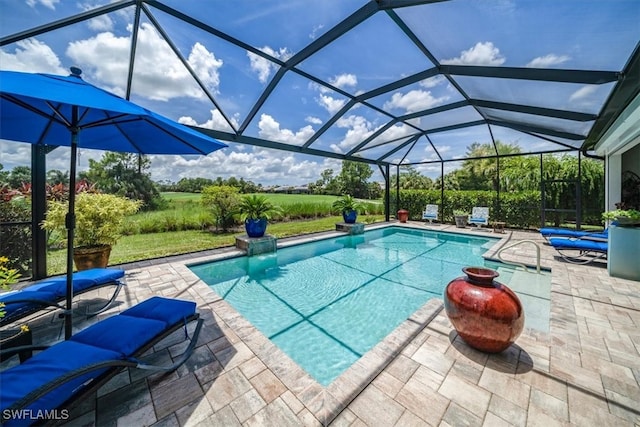 outdoor pool with glass enclosure and a patio