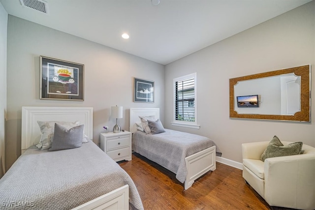 bedroom featuring dark wood-type flooring