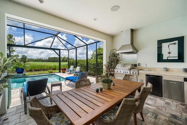 view of patio featuring an outdoor kitchen, a lanai, a sink, a grill, and an outdoor pool