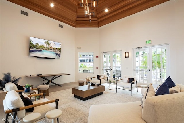 living room featuring french doors and a high ceiling