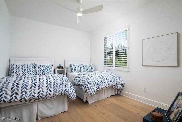 bedroom featuring wood-type flooring and ceiling fan