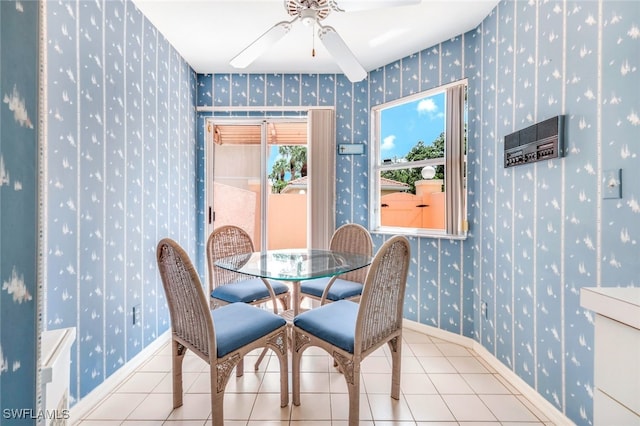 dining area featuring ceiling fan and light tile patterned flooring