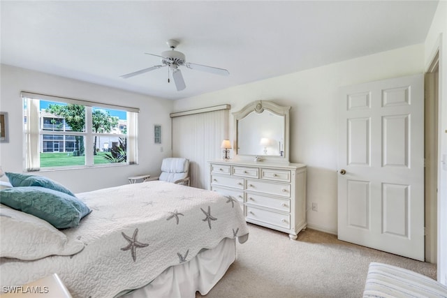 carpeted bedroom featuring ceiling fan