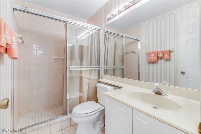 bathroom featuring vanity, an enclosed shower, tile patterned floors, and toilet