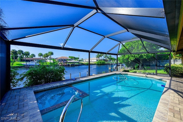 view of pool featuring glass enclosure