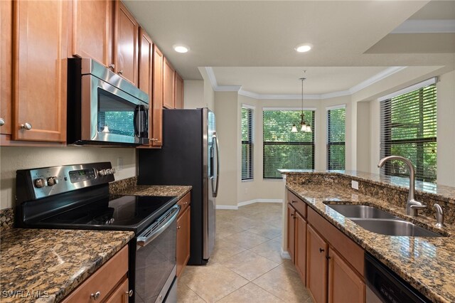 kitchen featuring light tile patterned flooring, sink, dark stone countertops, crown molding, and stainless steel appliances