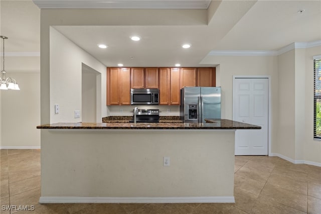 kitchen featuring dark stone counters, appliances with stainless steel finishes, and light tile patterned floors