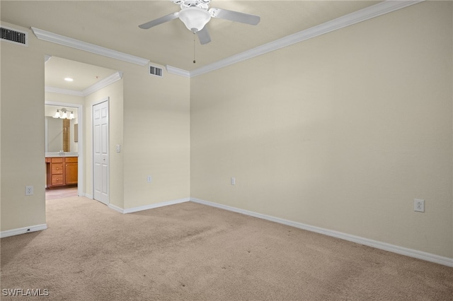 carpeted empty room featuring ceiling fan and ornamental molding