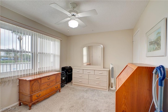 1828 Pine Valley Dr Unit 211, Fort Myers, FL 33907 - bedroom with light carpet, a textured ceiling, and ceiling fan