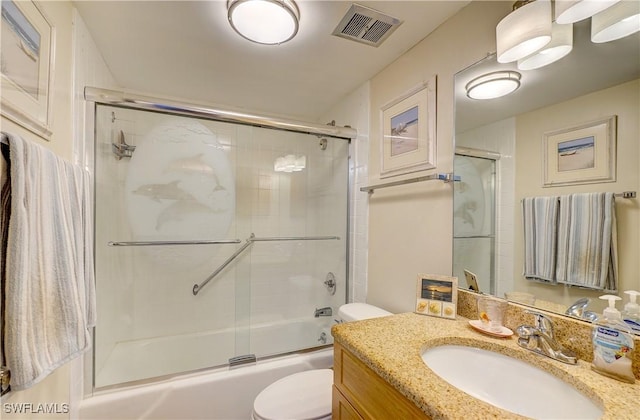 full bathroom with toilet, vanity, and combined bath / shower with glass door