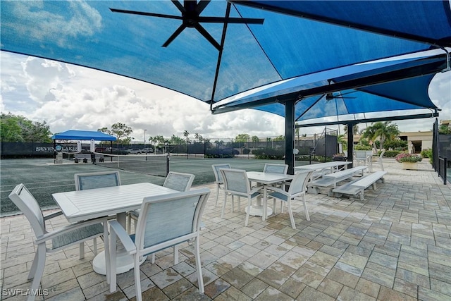 view of patio featuring tennis court