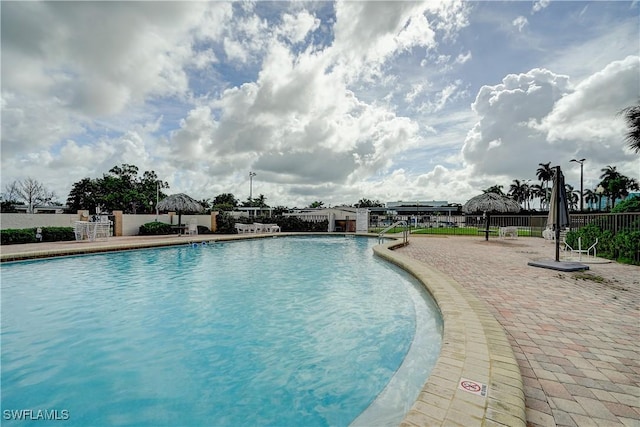 view of swimming pool with a patio area