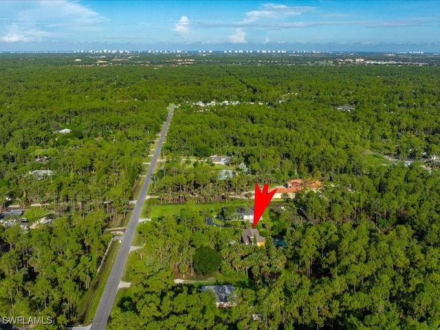 aerial view featuring a forest view