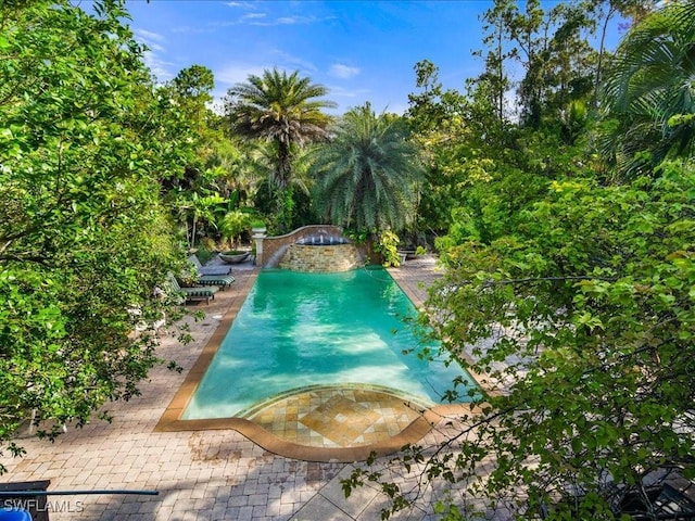 view of swimming pool featuring a patio