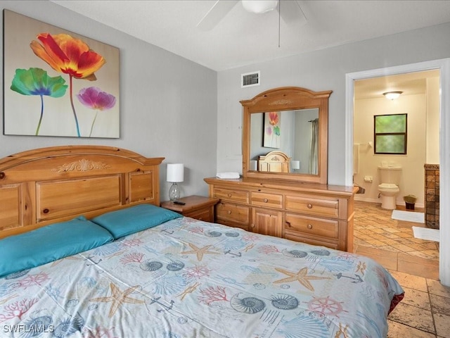 bedroom featuring ensuite bathroom, ceiling fan, stone tile flooring, and visible vents