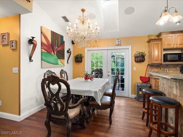 dining space with baseboards, visible vents, lofted ceiling, dark wood-type flooring, and french doors